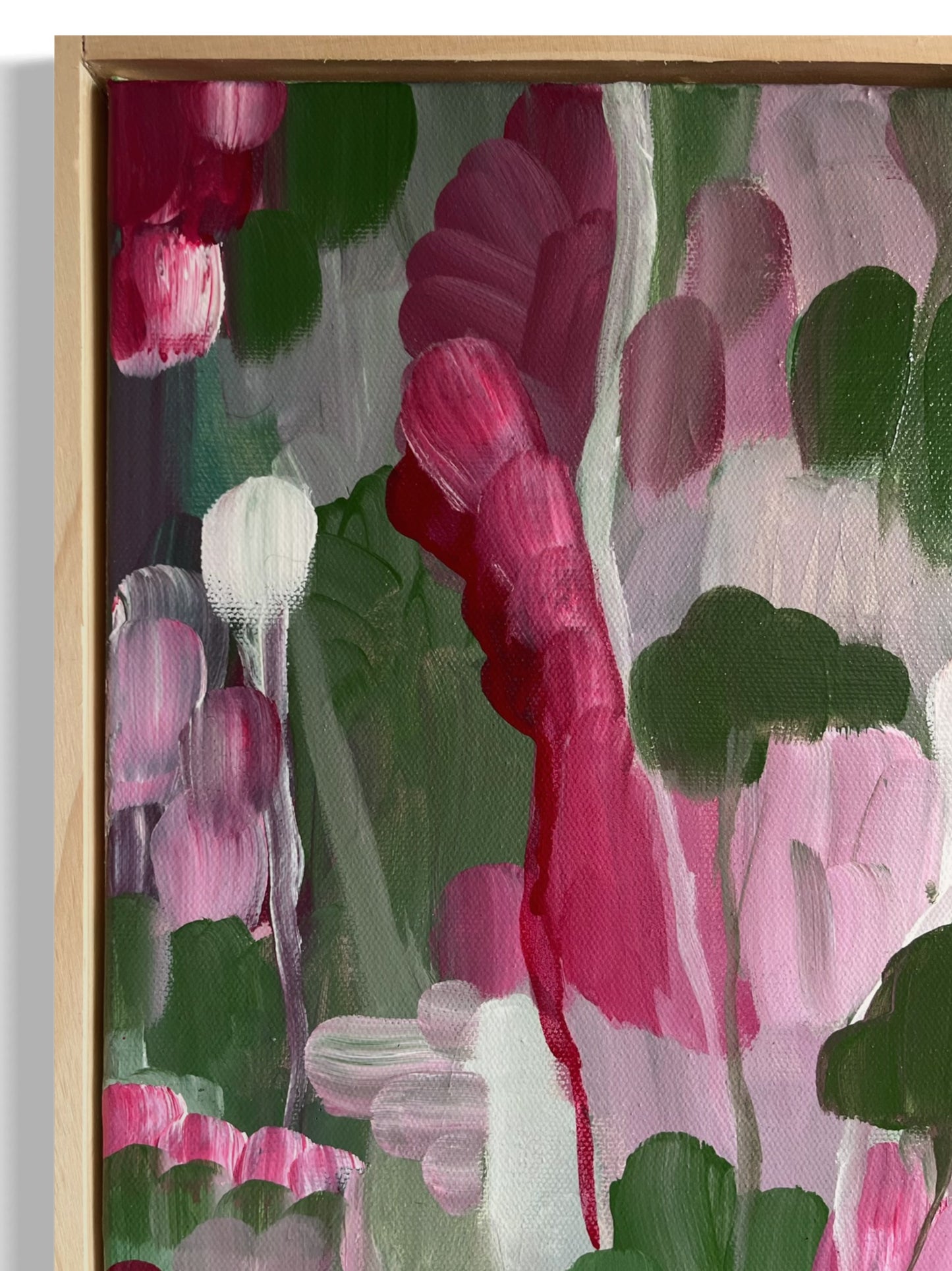 Original hand painted acrylic painting on canvas of an abstract jungle scene. Bold strokes of pinks, deep greens, and purples create a dynamic and vibrant landscape. The composition evokes the energy of the jungle through abstract forms and rich, contrasting colours close-up.