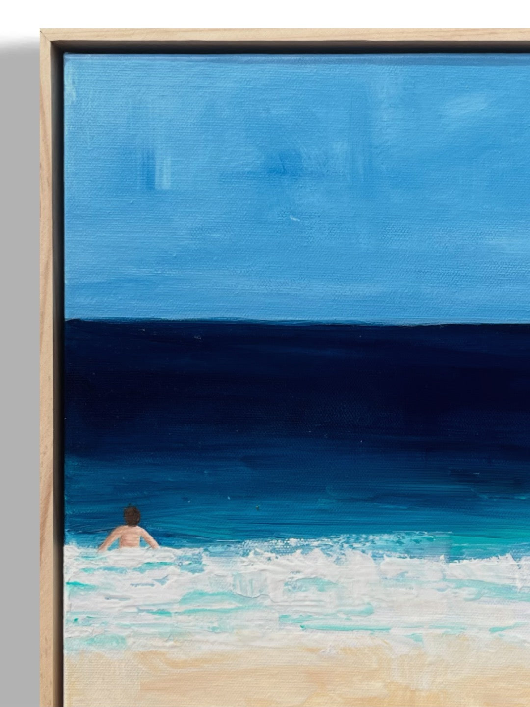 Original hand painted acrylic painting on canvas of a swimmer in the deep blue ocean. The scene captures the swimmer surrounded by water, with golden sand adding warmth to the composition. The deep blues of the water contrast with the soft, warm tones of the shore close-up.