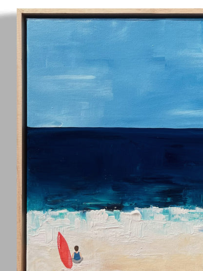Original hand painted acrylic painting on canvas of a surfer in front of the deep blue ocean. The scene captures a surfer by his surf board, with golden sand adding warmth to the composition. The deep blues of the water contrast with the soft, warm tones of the shore close-up.